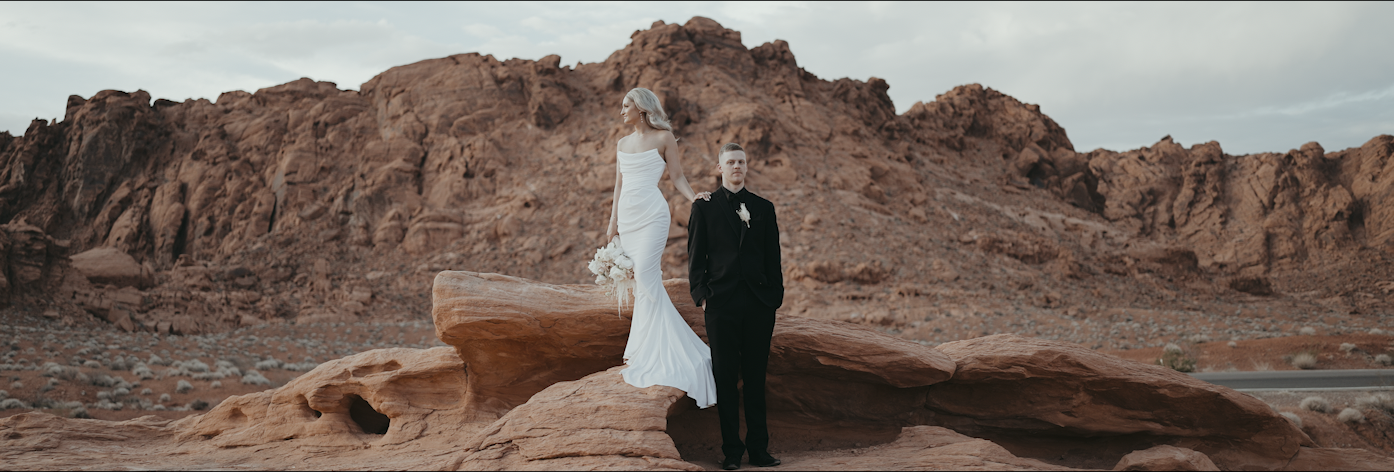 Photo of a couple in Valley of fire. Shows the landscape.