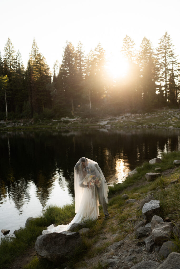 Image of bride and groom near lakeside